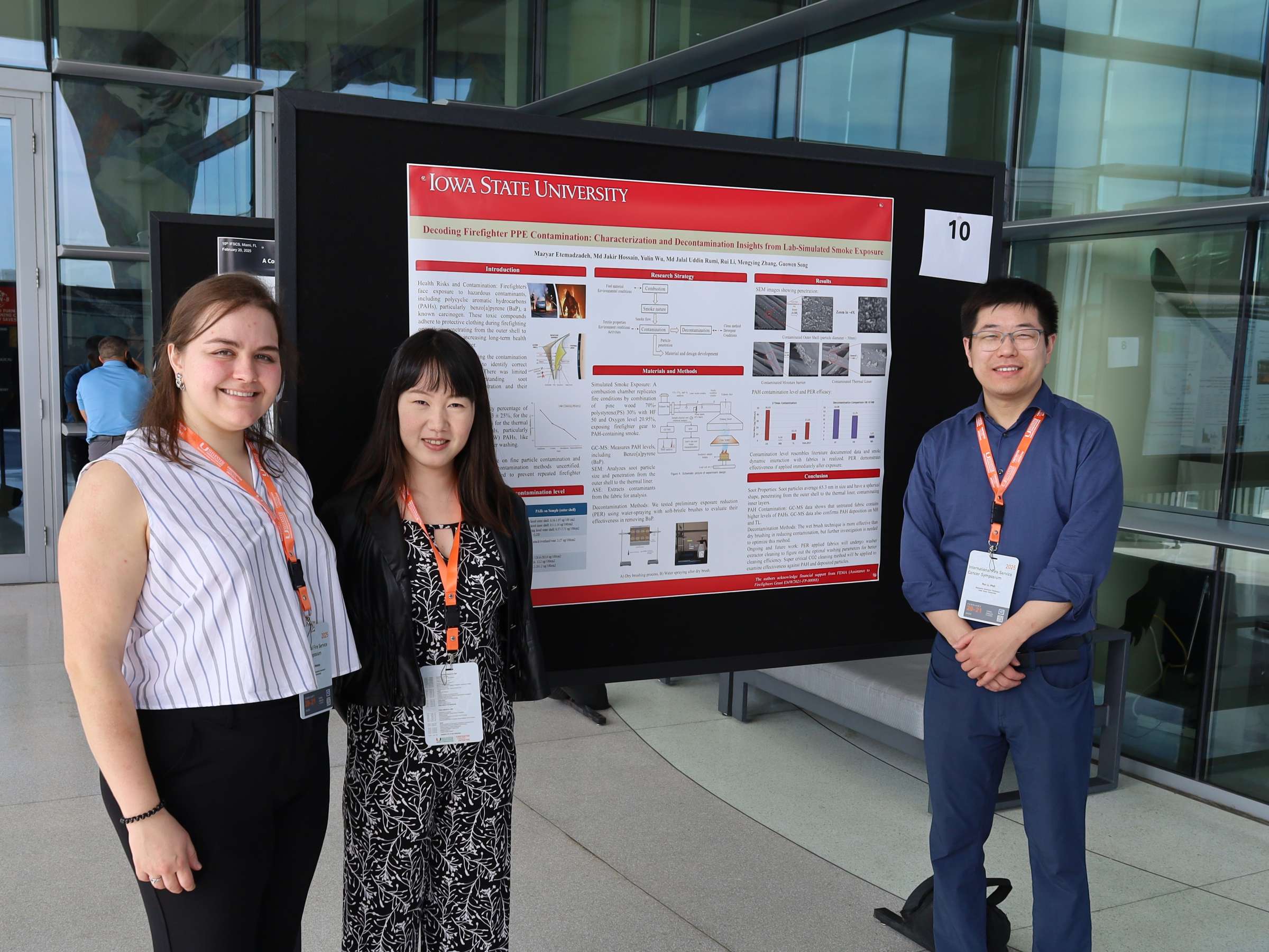 NexGen PPT members standing with presenting poster